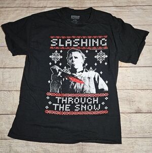 Horror Halloween Michael Myers slashing through the snow holiday tee shirt